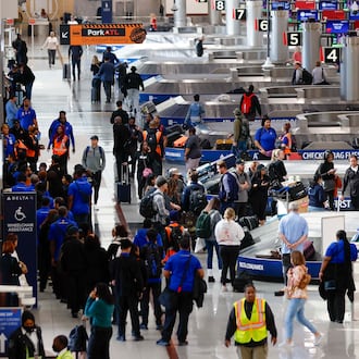 Travelers walk around the baggage claim in the South Terminal at Hartsfield-Jackson Atlanta International Airport on Thursday, Nov. 6, 2025. Atlanta is among the airports where the FAA will reduce flights due to the shutdown, and airports are facing a shortage of air traffic controllers.
(Miguel Martinez/ AJC)