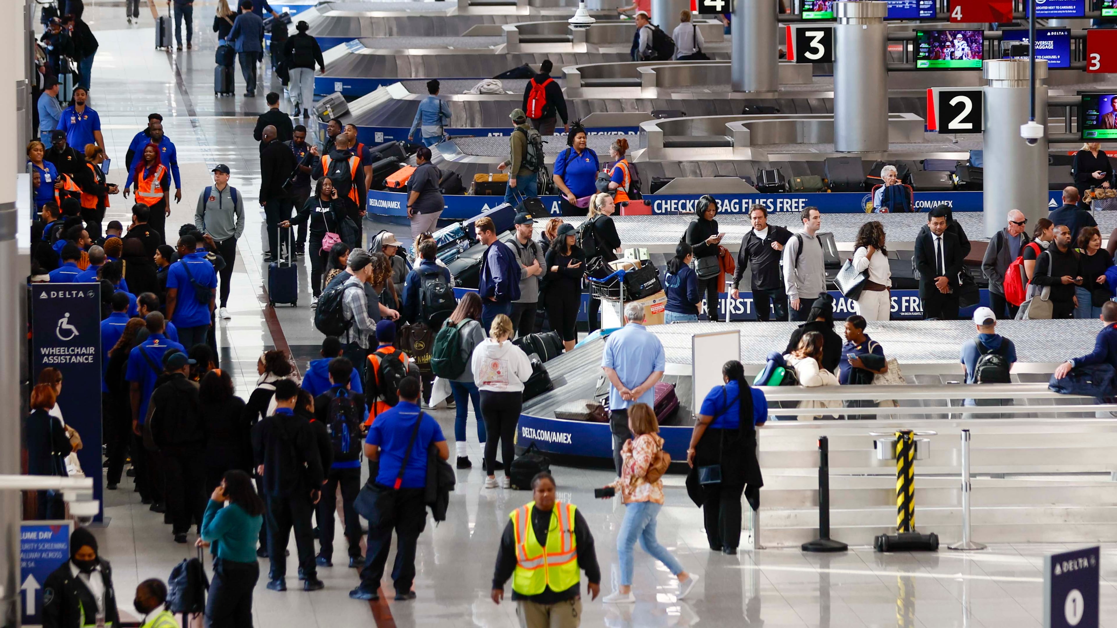 Travelers walk around the baggage claim in the South Terminal at Hartsfield-Jackson Atlanta International Airport on Thursday, Nov. 6, 2025. Atlanta is among the airports where the FAA will reduce flights due to the shutdown, and airports are facing a shortage of air traffic controllers.
(Miguel Martinez/ AJC)
