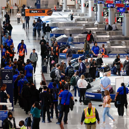 Travelers walk around the baggage claim in the South Terminal at Hartsfield-Jackson Atlanta International Airport on Thursday, Nov. 6, 2025. Atlanta is among the airports where the FAA will reduce flights due to the shutdown, and airports are facing a shortage of air traffic controllers.
(Miguel Martinez/ AJC)