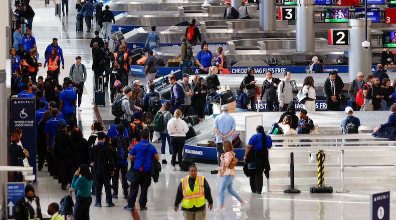 Travelers walk around the baggage claim in the South Terminal at Hartsfield-Jackson Atlanta International Airport on Thursday, Nov. 6, 2025. Atlanta is among the airports where the FAA will reduce flights due to the shutdown, and airports are facing a shortage of air traffic controllers.
(Miguel Martinez/ AJC)