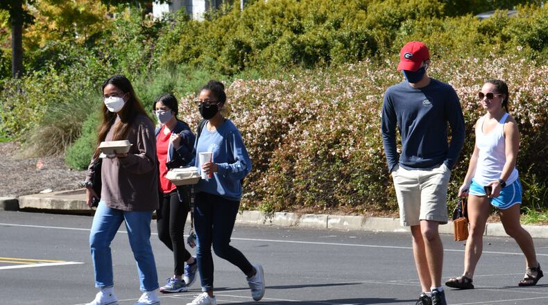 September 23, 2020 Athens - Students mostly wear face masks as they make their way through the campus in the University of Georgia campus in Athens on Wednesday, September 23, 2020. Maia Gibson was diagnosed with COVID near the start of the semester. She's okay now. Gibson now wants UGA to conduct more testing and enact other measures to reduce the spread of COVID-19 on the campus. (Hyosub Shin / Hyosub.Shin@ajc.com)