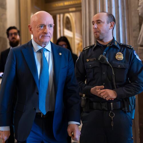 Sen. Mark Kelly, D-Ariz., exits the Senate chamber after speaking out against Defense Secretary Pete Hegseth's efforts to censure him over his participation in a video that called on troops to resist unlawful orders, at the Capitol in Washington, Monday, Jan. 12, 2026. (AP Photo/J. Scott Applewhite)