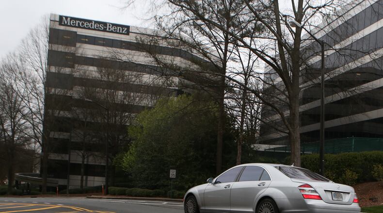 A Mercedes-Benz sedan drives past the Mercedes-Benz USA corporate office building in Sandy Springs on March 13, 2017. Mercedes-Benz is one of the many large companies that benefits from multi-million-dollar government incentives. (HENRY TAYLOR / HENRY.TAYLOR@AJC.COM)