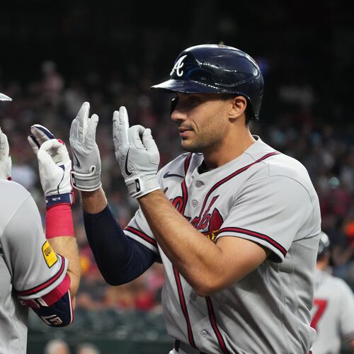 Atlanta Braves' Matt Olson celebrates with Mike Yastrzemski (18) after hitting a solo home run against the Arizona Diamondbacks in the first inning of a baseball game, Thursday, April 2, 2026, in Phoenix. (AP Photo/Rick Scuteri)