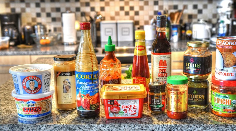 Condiments once considered exotic — such as miso, tahini, harissa, gochujang and kimchi — are now mainstream in restaurants and home kitchens. STYLING BY SUSAN PUCKETT / CONTRIBUTED BY CHRIS HUNT PHOTOGRAPHY