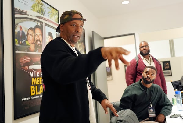 FILE - Filmmaker and former professional basketball player Deon Taylor, left, discusses the movie industry as Las Vegas Raiders linebacker K'Lavon Chaisson, seated, and retired NFL player Reginald Kahlil McKenzie look on during a filmmaking workshop for NFL players on Tuesday, March 4, 2025, in Santa Monica, Calif. (AP Photo/Chris Pizzello, file)