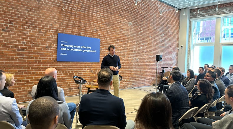 Cox Enterprises Chairman and CEO Alex Taylor talks on Tuesday, Feb. 27, 2024, with employees of OpenGov. On Tuesday, Cox announced it has purchased a majority stake in the public sector software company. SPECIAL