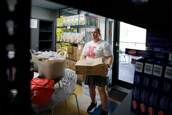 Food Pantry Coordinator Teresa Acosta of the Latin American Association is seen organizing food boxes after receiving donations from the Atlanta Community Food Bank and Bank of America on Monday, Nov 24, 2025. (Miguel Martinez/ AJC)