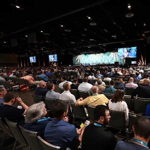 FILE - Attendees listen to a presentation during the annual meeting of the Southern Baptist Convention, Tuesday, June 9, 2026, in Orlando, Fla. (AP Photo/Phelan M. Ebenhack, File)