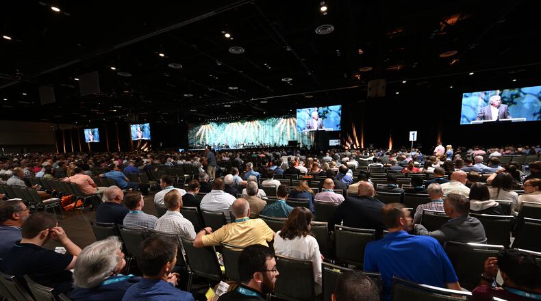 FILE - Attendees listen to a presentation during the annual meeting of the Southern Baptist Convention, Tuesday, June 9, 2026, in Orlando, Fla. (AP Photo/Phelan M. Ebenhack, File)