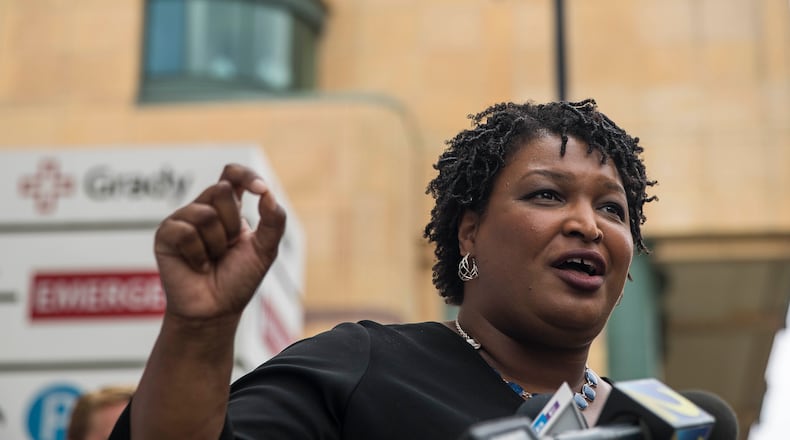 Democratic nominee for governor Stacey Abrams offers details of her health care plan outside Grady Memorial Hospital in Atlanta on Monday. ALYSSA POINTER/ALYSSA.POINTER@AJC.COM