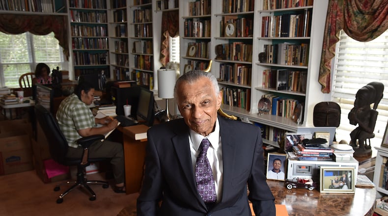 Portrait of C.T. Vivian at his home library as his daughter Charisse Thornton (background) and Dawnn Mitchell work on checking inventory on Tuesday, July 25, 2017. The National Monuments Foundation will be acquiring and managing the world-class library of Atlanta Civil Rights icon, C.T. Vivian. (Photo: HYOSUB SHIN / HSHIN@AJC.COM)