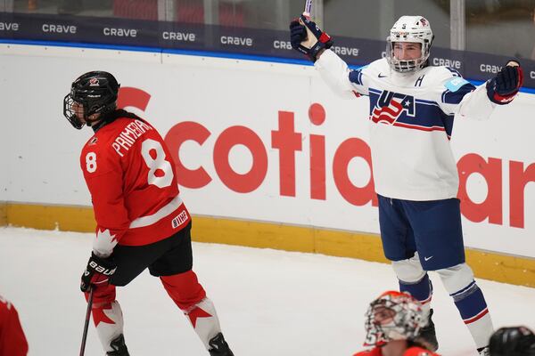 United States' Megan Keller celebrates after scoring her sides second goal during the group A match between United States and Canada at the Women's Ice Hockey Championships in Ceske Budejovice, Czech Republic, Sunday, April 13, 2025. (AP Photo/Petr David Josek)