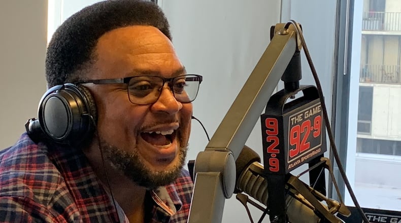 Carl Dukes during his 92.9/The Game show with Mike Bell in December 16, 2022. RODNEY HO/rho@ajc.com