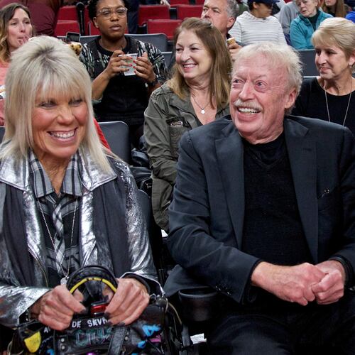 FILE - Phil Knight, right, and Penny Knight, watch the first half of an NCAA college basketball game in the Phil Knight Invitational tournament in Portland, Ore., on Nov. 26, 2017. (AP Photo/Craig Mitchelldyer, File)