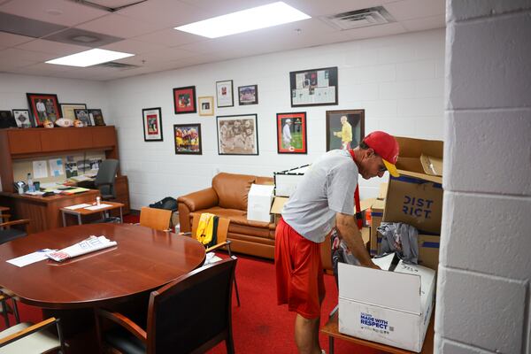 Clarke Central coach David Perno looks for team shirts in his office at Clarke Central in Athens on Tuesday, July 7, 2026. (Arvin Temkar/AJC)