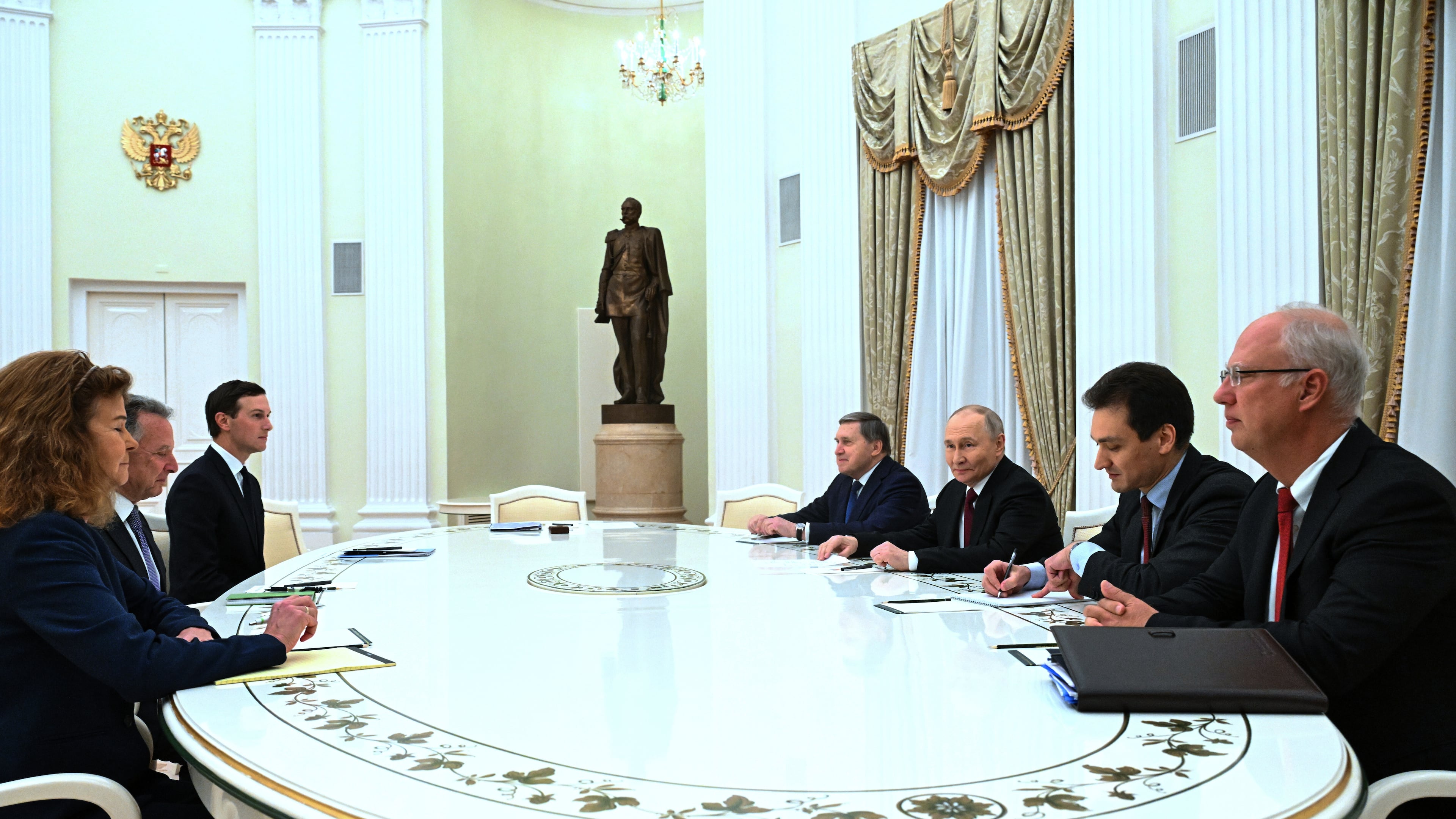 Russian President Vladimir Putin, third right, Russian Presidential foreign policy adviser Yuri Ushakov, fourth right, and Russian Direct Investment Fund CEO Special Presidential Representative for Investment and Economic Cooperation with Foreign Countries Kirill Dmitriev, right, attend the talks with U.S. special envoy Steve Witkoff, second left, and Jared Kushner, U.S. President Donald Trump's son-in-law, third, at the Senate Palace of the Kremlin in Moscow, Russia, Tuesday, Dec. 2, 2025. (Kristina Kormilitsyna/Sputnik, Kremlin Pool Photo via AP)