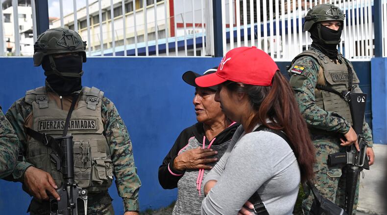 Women seek information about the expected arrival of their relatives who were aboard the Maria Candelaria, a vessel intercepted two days prior by U.S. authorities on suspicion of alleged drug trafficking, at the port in Manta, Ecuador, Monday, Sept. 7, 2026. (AP Photo/Ariel Ochoa)