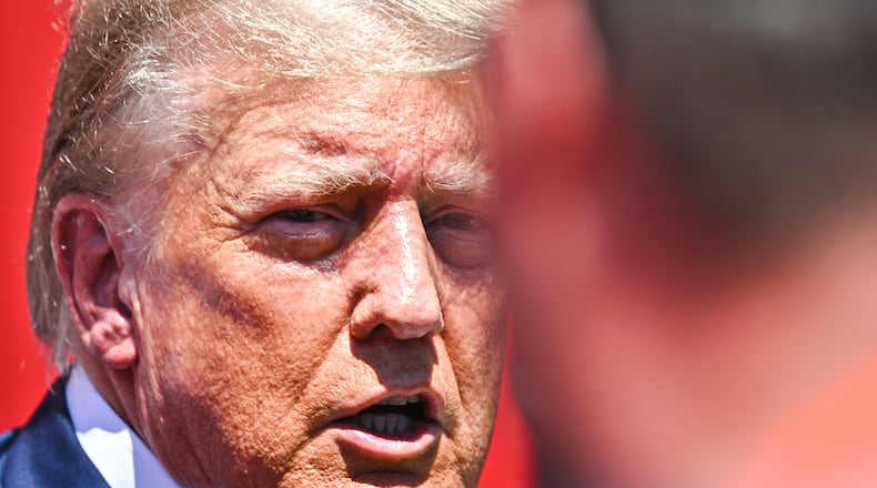 Former President Donald Trump at the Iowa Pork Producers Tent, on a visit to the Iowa State Fair in Des Moines on Saturday, Aug. 12, 2023. Trump said “all charges should be dropped against me & others” as he announced a news conference he plans to host on Monday, Aug. 21, 2023. (Jon Cherry/The New York Times).