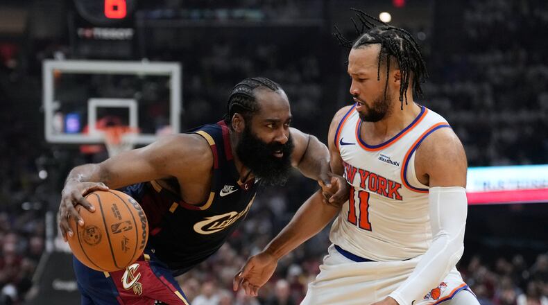 Cleveland Cavaliers guard James Harden (1) controls the ball against New York Knicks guard Jalen Brunson (11) during the second half of Game 3 in the Eastern Conference finals NBA basketball playoffs series in Cleveland, Monday, May 24, 2027. (AP Photo/Sue Ogrocki)