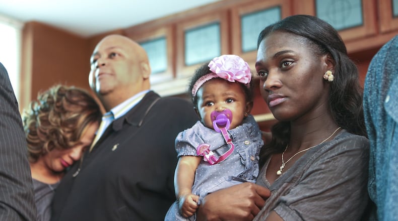 Cajun Snorton (right) was engaged to Nick Thomas who was shot in the back by a Smyrna police officer claiming he was protecting a fellow officer. Now, Snorton is suing.