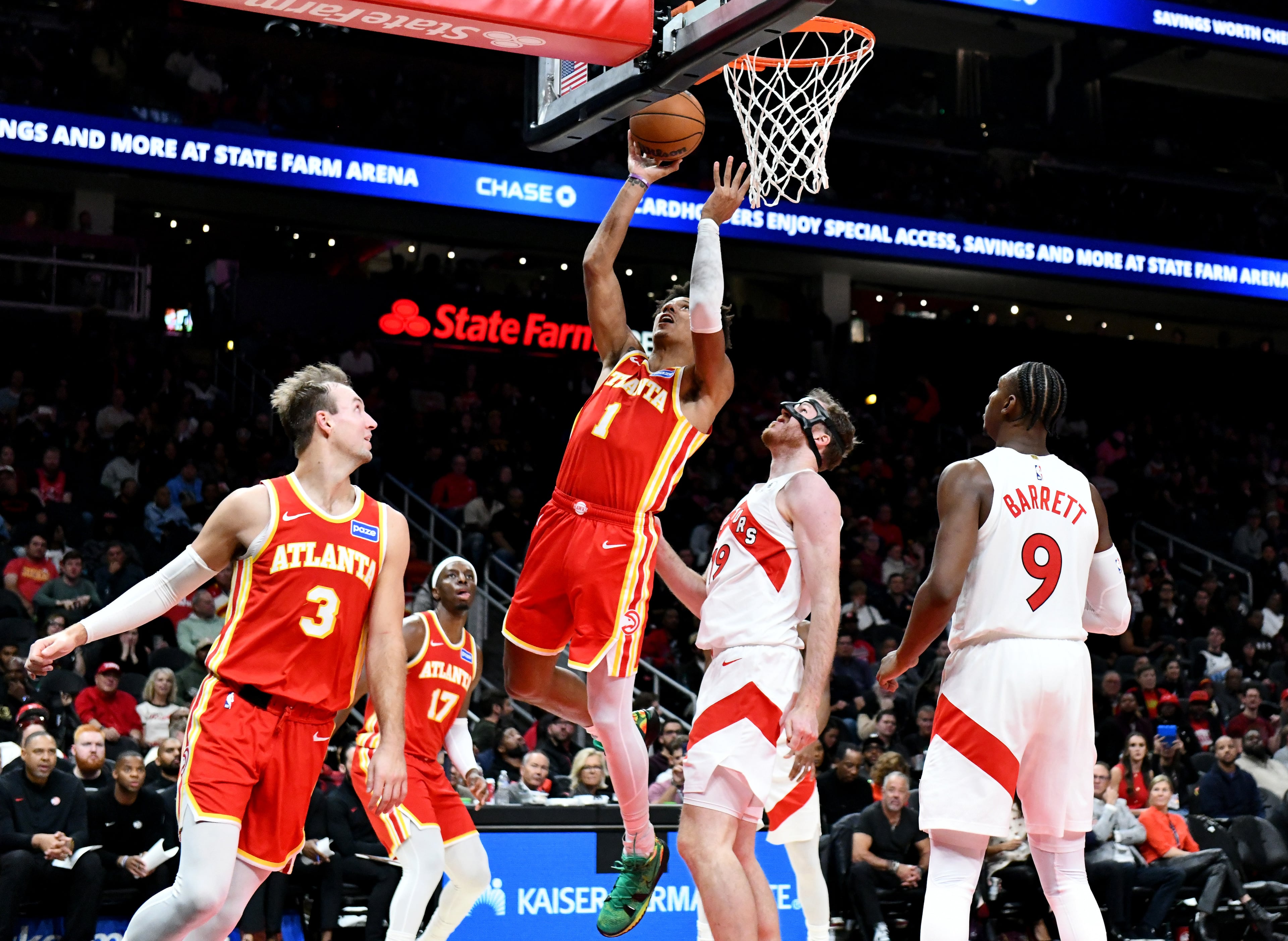 Atlanta Hawks forward Jalen Johnson (1) goes to the basket for the shot during the second half in the home opener at State Farm Arena, Thursday, October 22, 2025, in Atlanta. Toronto Raptors won 138-118 over Atlanta Hawks. (Hyosub Shin / AJC)