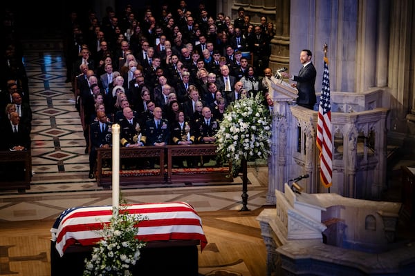  Jason Carter, grandson of former President Jimmy Carter, delivers a tribute at Carter’s funeral in the National Cathedral on Jan. 9. (Erin Schaff/The New York Times) 