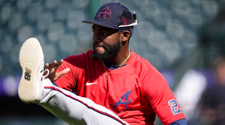Atlanta Braves right fielder Michael Harris II warms up before a baseball game against the Colorado Rockies Thursday, June 2, 2022, in Denver. (AP Photo/David Zalubowski)
