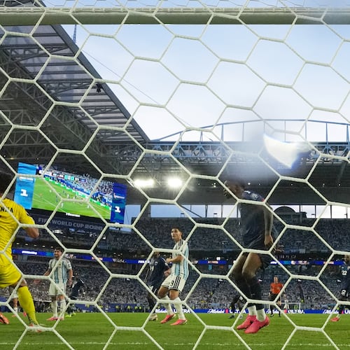 Cape Verde goalkeeper Vozinha (1) is scored on by Argentina's Lisandro Martinez during the World Cup round of 32 soccer match between Argentina and Cape Verde in Miami Gardens, Fla., Friday, July 3, 2026. (AP Photo/Lynne Sladky)