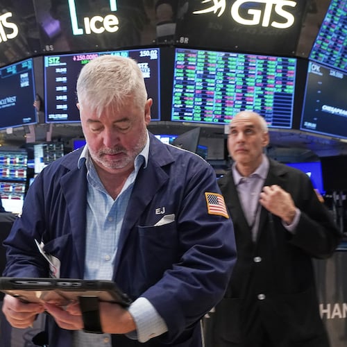 Trader Edward McCarthy, center, works on the floor of the New York Stock Exchange, Tuesday, May 5, 2026. (AP Photo/Richard Drew)