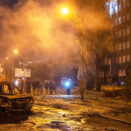 A burned car is seen after a Russian missile attack in Kyiv, Ukraine, Saturday, Aug. 1, 2026. (AP Photo/Dan Bashakov)