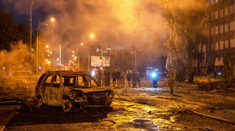 A burned car is seen after a Russian missile attack in Kyiv, Ukraine, Saturday, Aug. 1, 2026. (AP Photo/Dan Bashakov)