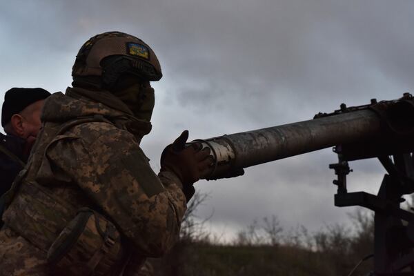 In this photo provided by Ukraine's 65th Mechanised Brigade press service, Ukrainian servicemen prepare to fire a multiple launch rocket system based on a pickup truck in the Zaporizhzhia region, Ukraine, Tuesday, April 8, 2025, (Andriy Andriyenko/Ukraine's 65th Mechanised Brigade via AP)