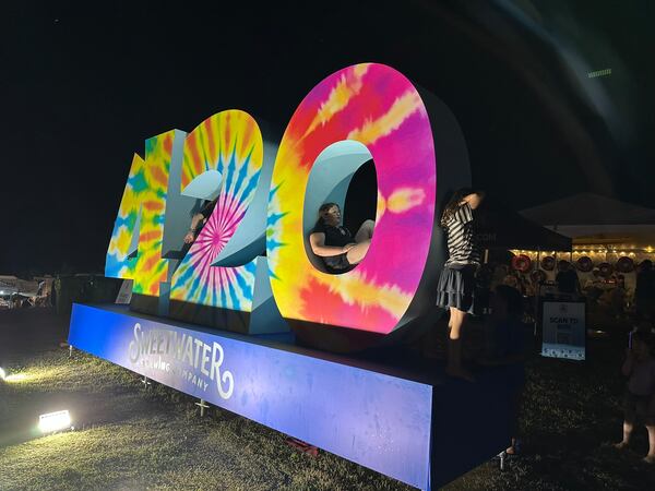 The SweetWater 420 Festival had a massive, Instagram-friendly logo on top of the hill at Shirley Clarke Franklin Park on Atlanta's west side on Saturday, April 18, 2026. (Rodney Ho/AJC)