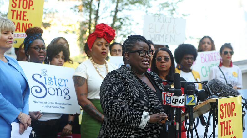 Monica Simpson, executive director of SisterSong, speaks at a press conference following the American Civil Liberties Union, the ACLU of Georgia, the Center for Reproductive Rights, and Planned Parenthood filing of a lawsuit challenging Georgia's HB 41, the 'heartbeat bill,' on the steps of the Richard B. Russell Federal Building, on Ted Turner Drive SW in Atlanta, on Friday, June 28, 2019. The 'heartbeat bill' set to take effect on January 1, 2020. The law bans abortion as early as six weeks into pregnancy, before many people even know they are pregnant. Supporters of the measure hope the law will serve as a test case that will rise to the U.S. Supreme Court and challenge Roe v. Wade. Legal experts expect a judge to issue a preliminary injunction to keep the law from going into effect until the case is settled by the courts.
