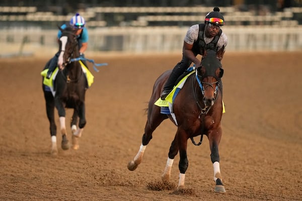 Publisher (right) and Tiztastic in action at Churchill Downs on Thursday.