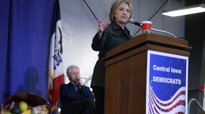 AMES, IA - NOVEMBER 15: Democratic presidential candidate Hillary Clinton speaks as her husband and former President Bill Clinton looks on during the Central Iowa DemocratsÕ fall barbecue November 15, 2015 at Hansen Agriculture Student Learning Center of Iowa State University in Ames, Iowa. Clinton continued to campaign for the nomination from the Democratic Party. (Photo by Alex Wong/Getty Images)