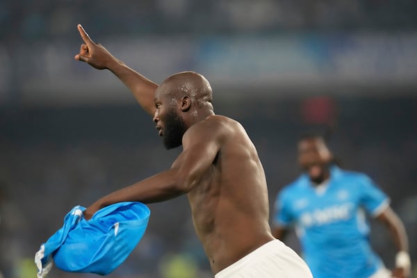 Napoli's Romelu Lukaku celebrates after scoring his side's 2nd goal during the Italian Serie A soccer match between Napoli and Cagliari at the Diego Maradona stadium in Naples, Italy, Friday, May 23, 2025. (AP Photo/Gregorio Borgia)