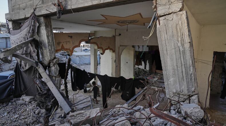 Displaced Palestinians shelter inside a building heavily damaged during the Israel-Hamas war in Gaza City, Thursday, Sept. 17, 2026. (AP Photo/Jehad Alshrafi)