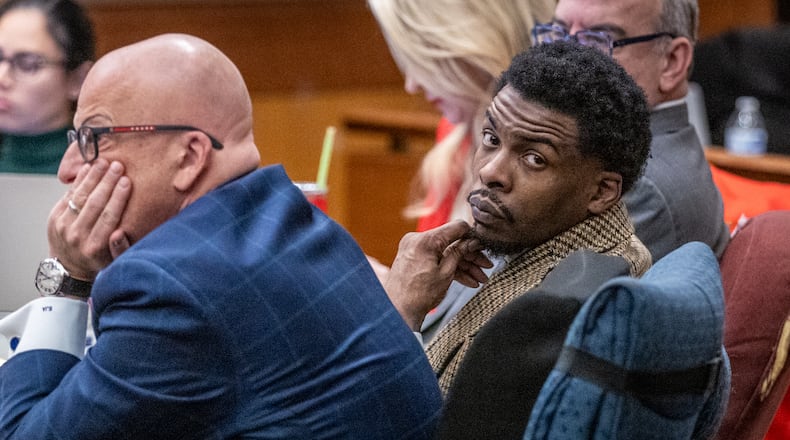 Deamonte Kendrick sits with his attorneys Monday morning ahead of opening statements in the YSL trial at Fulton County Courthouse on Monday, Nov. 27, 2023. (Steve Schaefer/steve.schaefer@ajc.com).