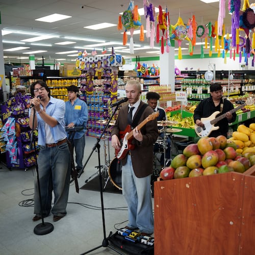 Bilingual alternative pop band Luna Luna performs in the produce section of Fiesta Fresh Market in New Castle, Del., on Sunday, April 26, 2026. (AP Photo/Mingson Lau)
