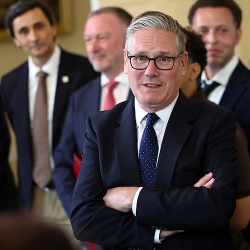 Britain's Prime Minister Keir Starmer, center, speaks with people whose lives who are said to have been improved by the Labour Government, during a meeting inside 10 Downing Street, central London, Wednesday July 15, 2026. (Henry Nicholls/Pool Photo via AP)
