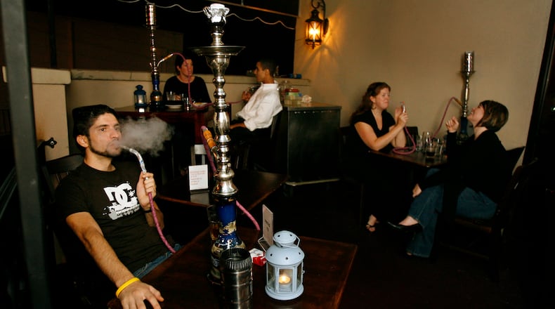 A hookah pipe is smoked at Ibiza Restaurant and Lounge on Peachtree Road in 2006 (Mikki K. Harris/AJC staff)