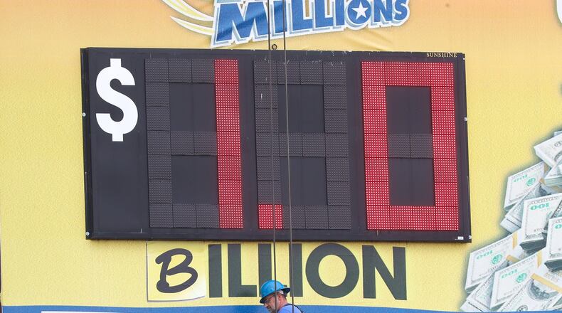 The Mega Millions billboard on Central Avenue in southwest Atlanta was modified back in October 2018 after the jackpot reached a record $1 billion. The ‘M’ in ‘Million’ was replaced with a ‘B.’ (AJC file photo / John Spink)
