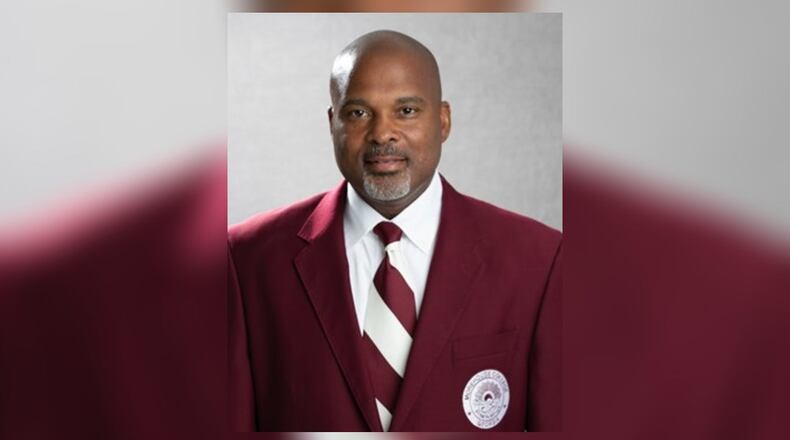 Phillip Thomas, Morehouse's associate athletic director and director of football operations, was booked on charges of aggravated assault and possession of a firearm during the commission of a felony.