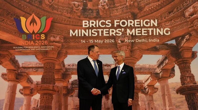 India's Foreign Minister S.Jaishankar, right, shakes hands with Russia's Foreign Minister Sergey Lavrov as he arrives for a two-day BRICS nations meeting in New Delhi, India, Thursday, May 14, 2026. (AP Photo/Manish Swarup)