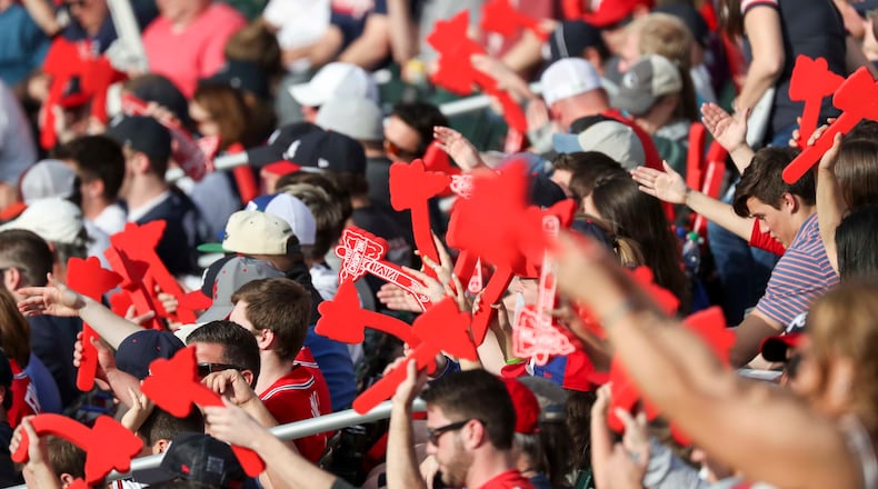 Braves Fans do the tomahawk chop during the season opener Thursday, March 29, 2018, against the Philadelphia Phillies at SunTrust Park.