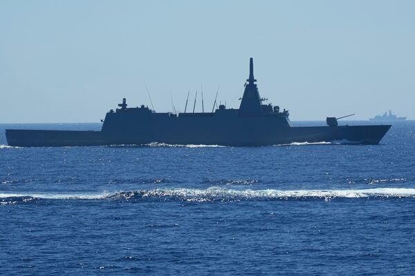 Japanese Maritime Self-Defence Force (JMSDF) frigate JS Noshiro maneuver as a Chinese navy ship is seen at right during the Philippines United States Japan Multilateral Maritime Cooperative Activity off a disputed South China Sea shoal on Friday, March 28, 2025. (AP Photo/Aaron Favila)