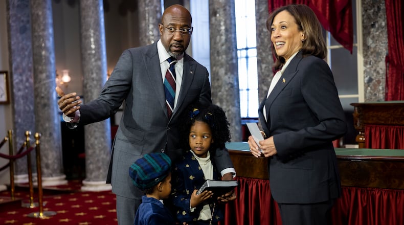 Senator Reverend Raphael Warnock (D-GA) arrives with his two children for his ceremonial swearing in with Vice President Kamala Harris at the Capitol in Washington, DC on January 3rd, 2022. (Nathan Posner for the Atlanta Journal-Constitution)