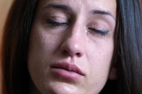 Oksana Tarasiuk cries as she talks about her husband, Maksym Chernyak, who died in ICE custody after being held in Krome Detention Center, at the couple's apartment in Hallandale Beach, Fla., Tuesday, April 22, 2025. (AP Photo/Rebecca Blackwell)